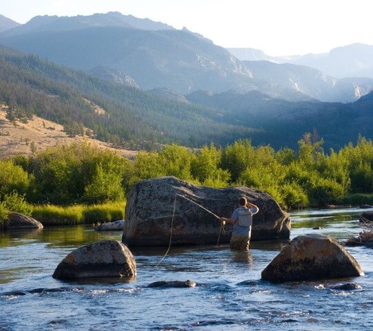 Attorney Jack Edwards fly fishing in the Snake River Wyoming