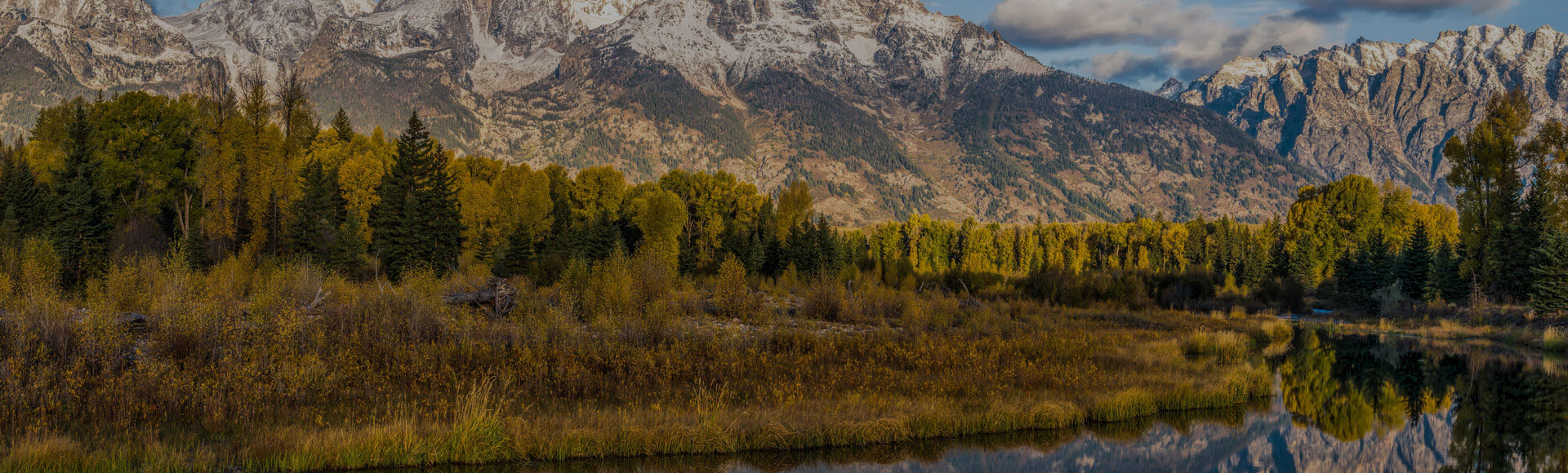 Autumn Teton Mountain scene in Wyoming with Snake River in foreground